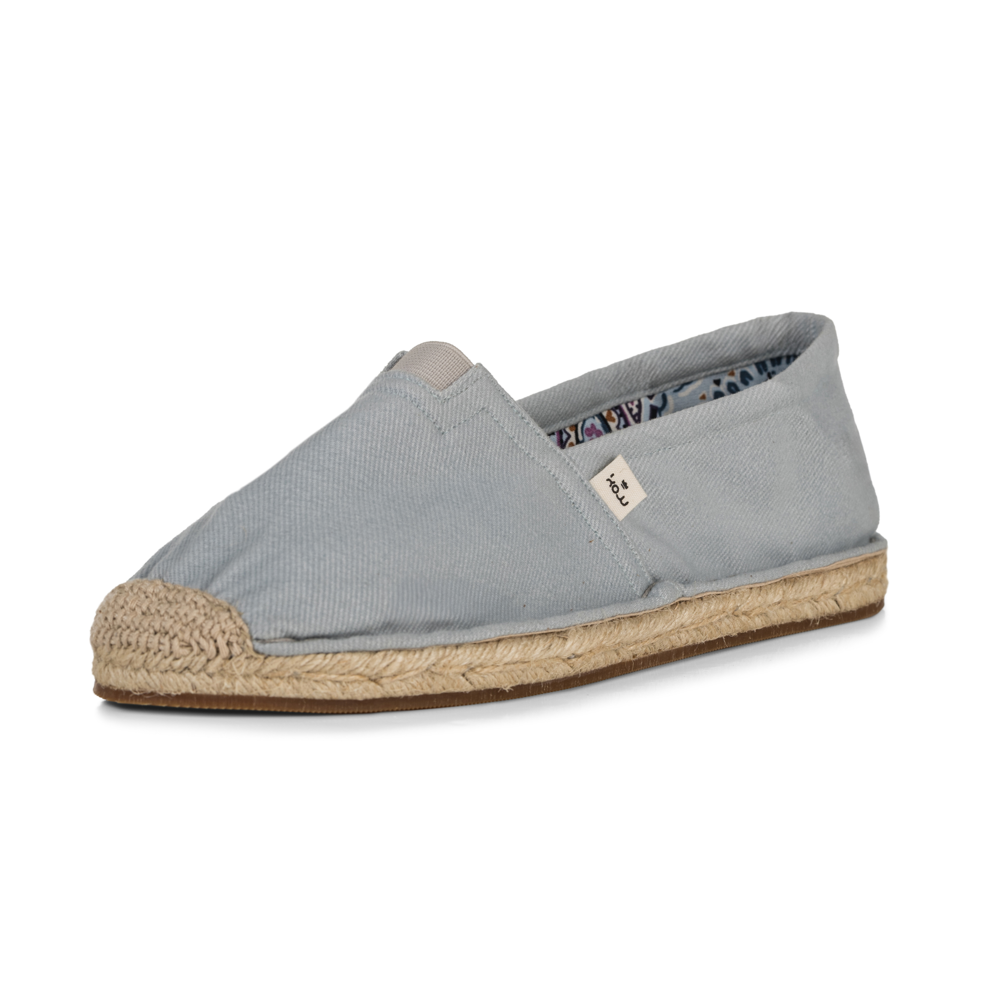 Light blue espadrille shoe with jute sole on a white background
