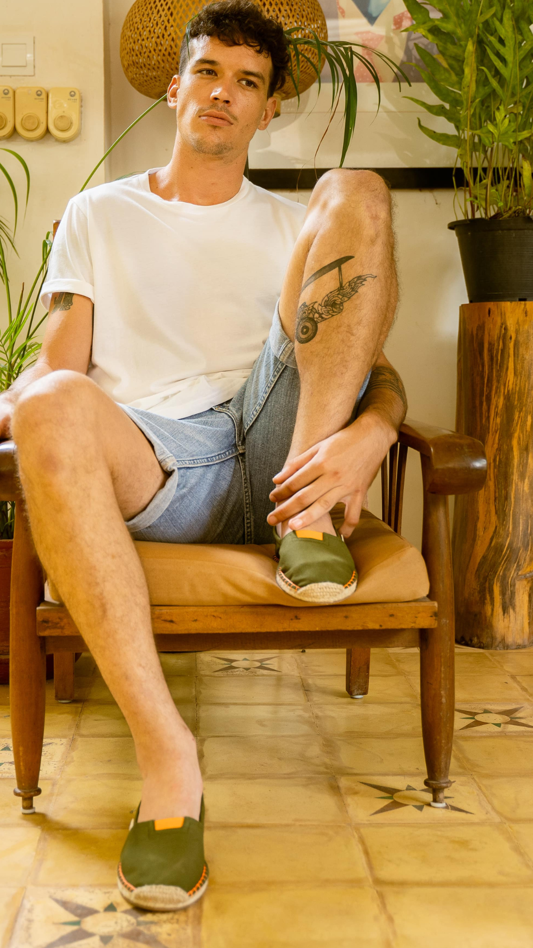 Man walking around wearing various styles of espadrilles in khaki green_video