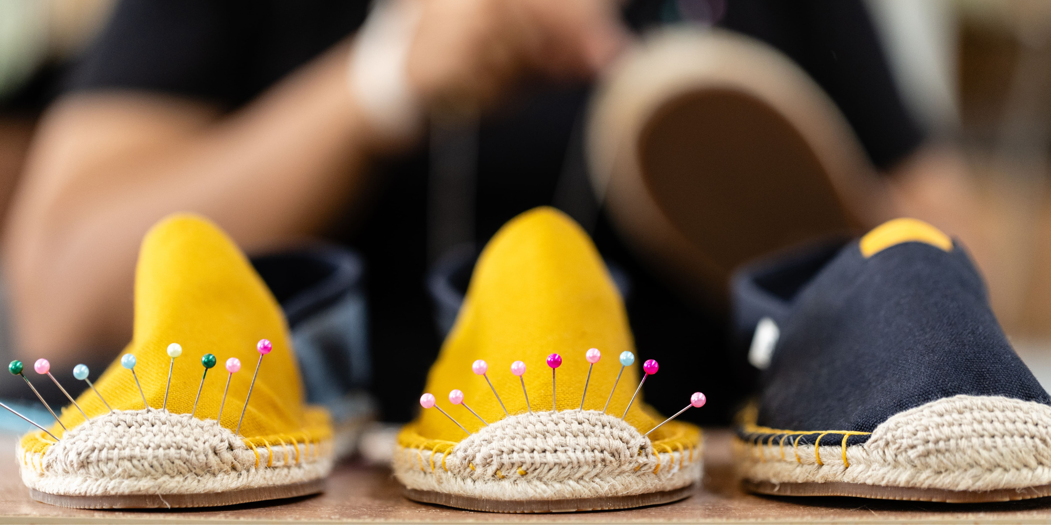 Woman relaxing on couch wearing handmade wool slippers