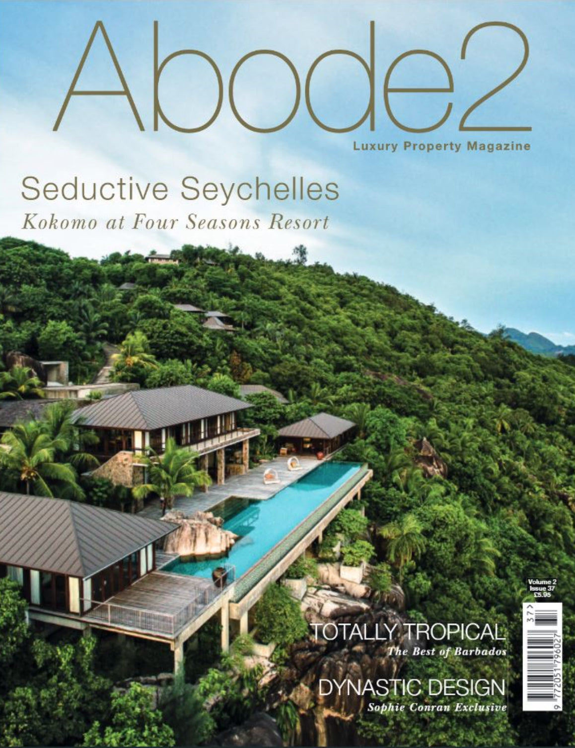 Abode2 magazine cover featuring a luxury resort in the Seychelles with lush greenery.