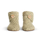 Floris x KOW slippers. A pair of winter moss green crocheted slippers with leather soles on a white background. Front view.