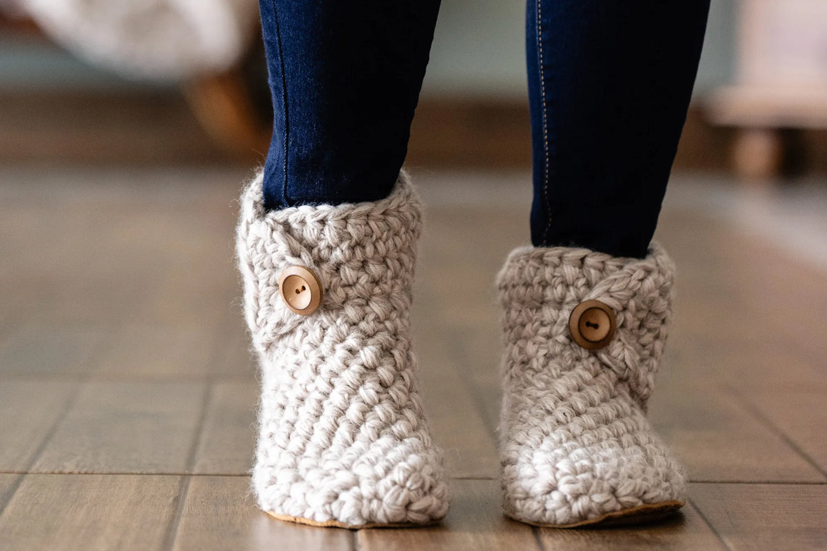Woman wearing extra chunky wool slippers handmade by KOW