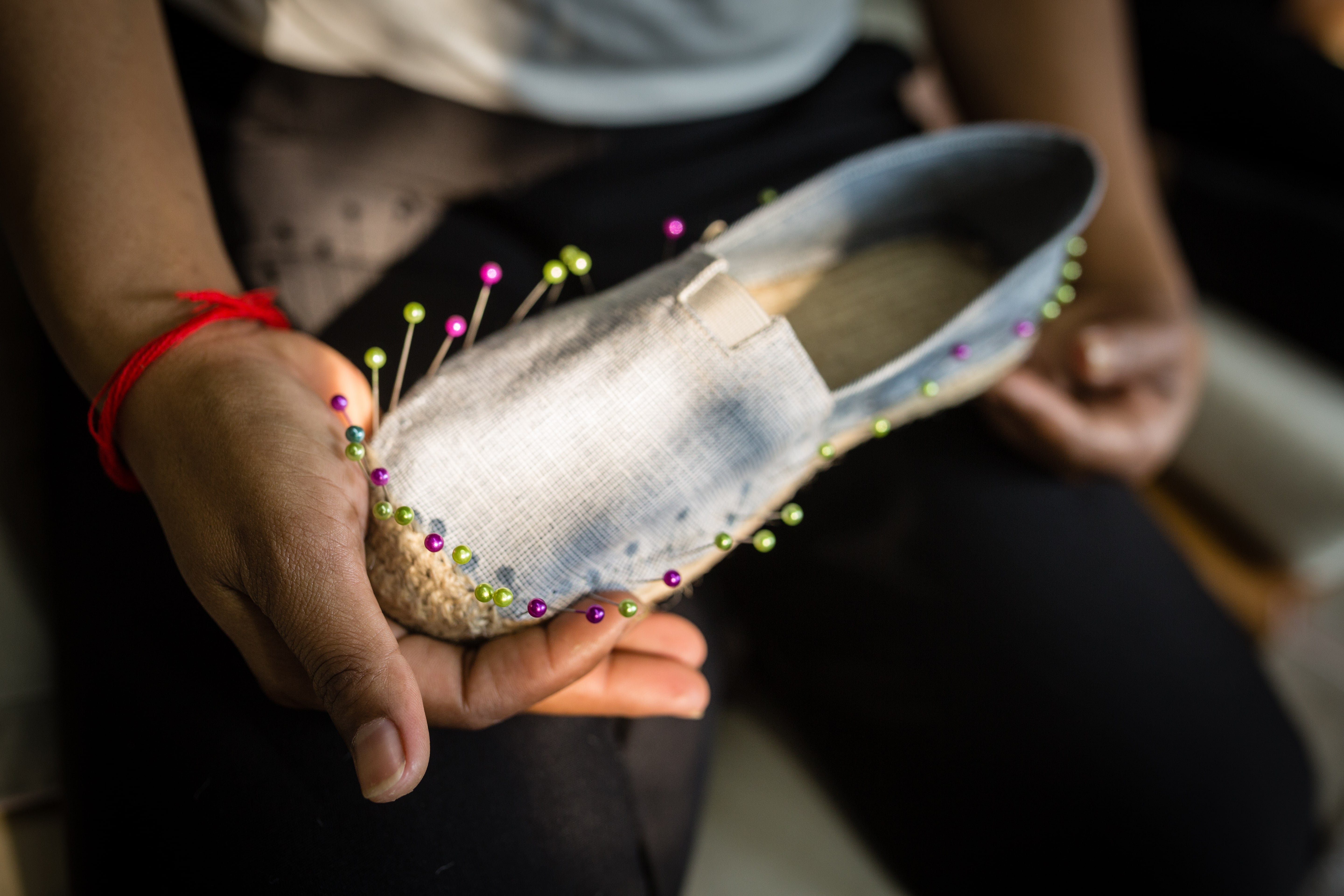 Kingdom of Wow Artisan making Light Gray Espadrilles