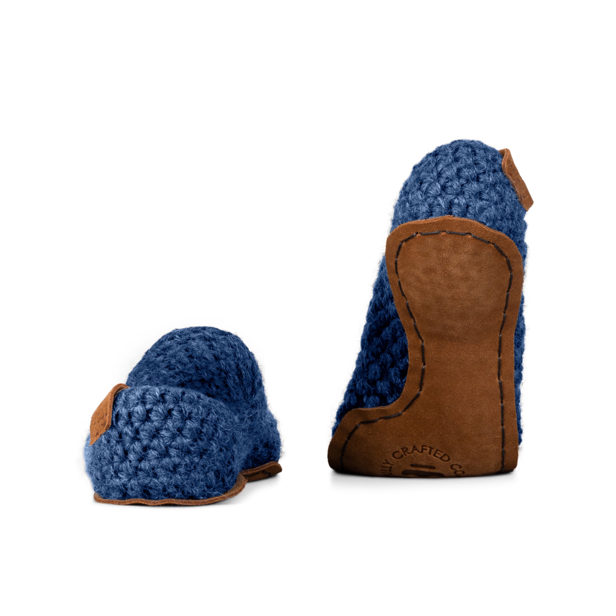 Blue wool slippers with leather soles on a white background