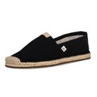 Black espadrille shoe with jute sole on a white background