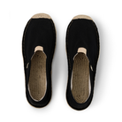 Pair of black slip-on espadrilles with jute soles on a white background