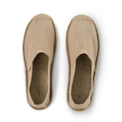 Pair of beige espadrilles with jute rope soles on a white background