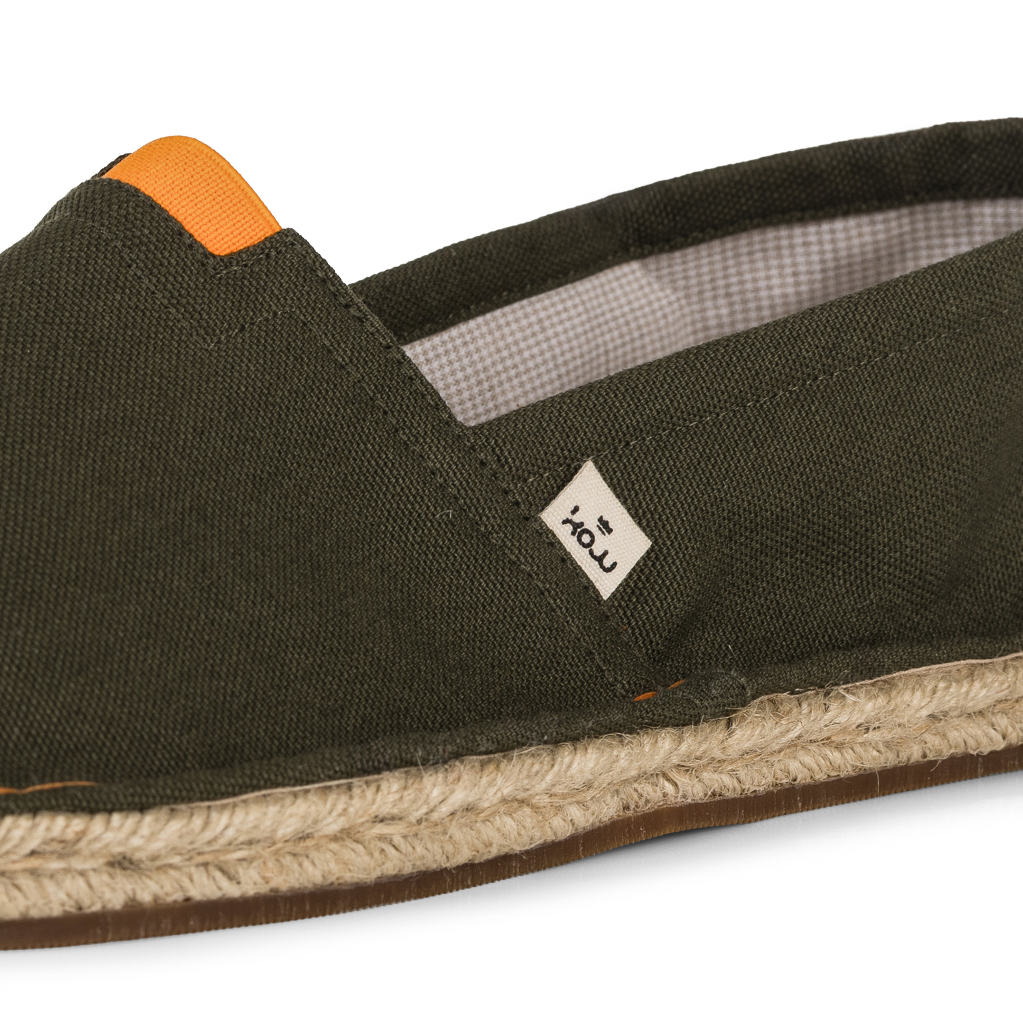 Khaki green espadrille shoe with orange accents on a white background