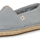 Light blue espadrille shoe with a KOW brand label on a white background