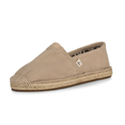 Beige espadrille shoe on a white background