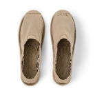 Pair of beige slip-on espadrilles with jute soles on a white background