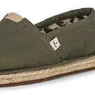 Olive green espadrille shoe with jute sole on a white background