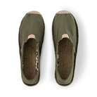 Pair of olive green slip-on shoes with leopard print inner and jute soles on a white background