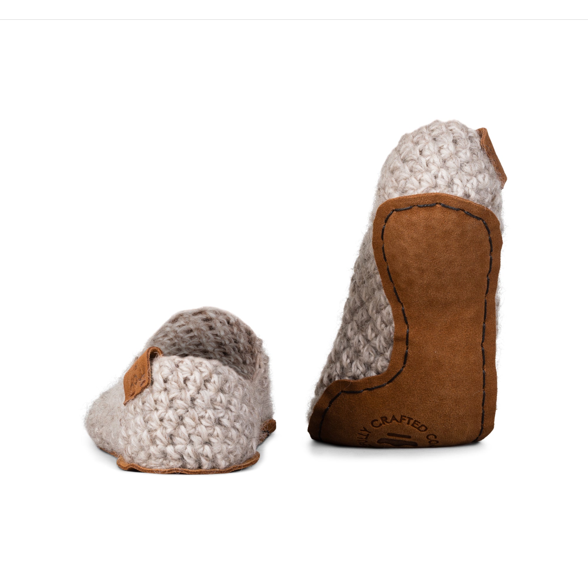 beige light slippers made from two strands of wool by Kingdom of Wow. Leather soles. Back view