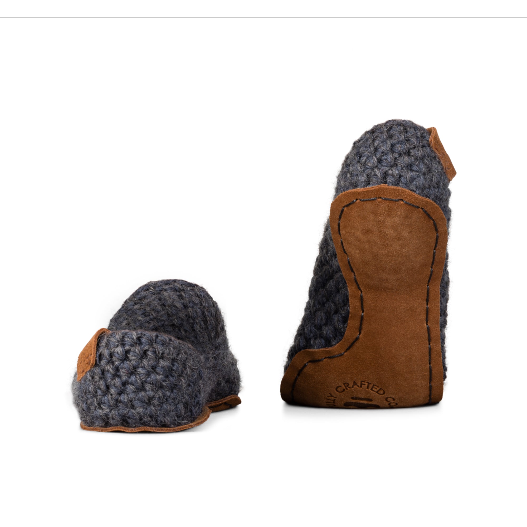 Dark gray light slippers made from two strands of wool by Kingdom of Wow. Leather soles. Back view