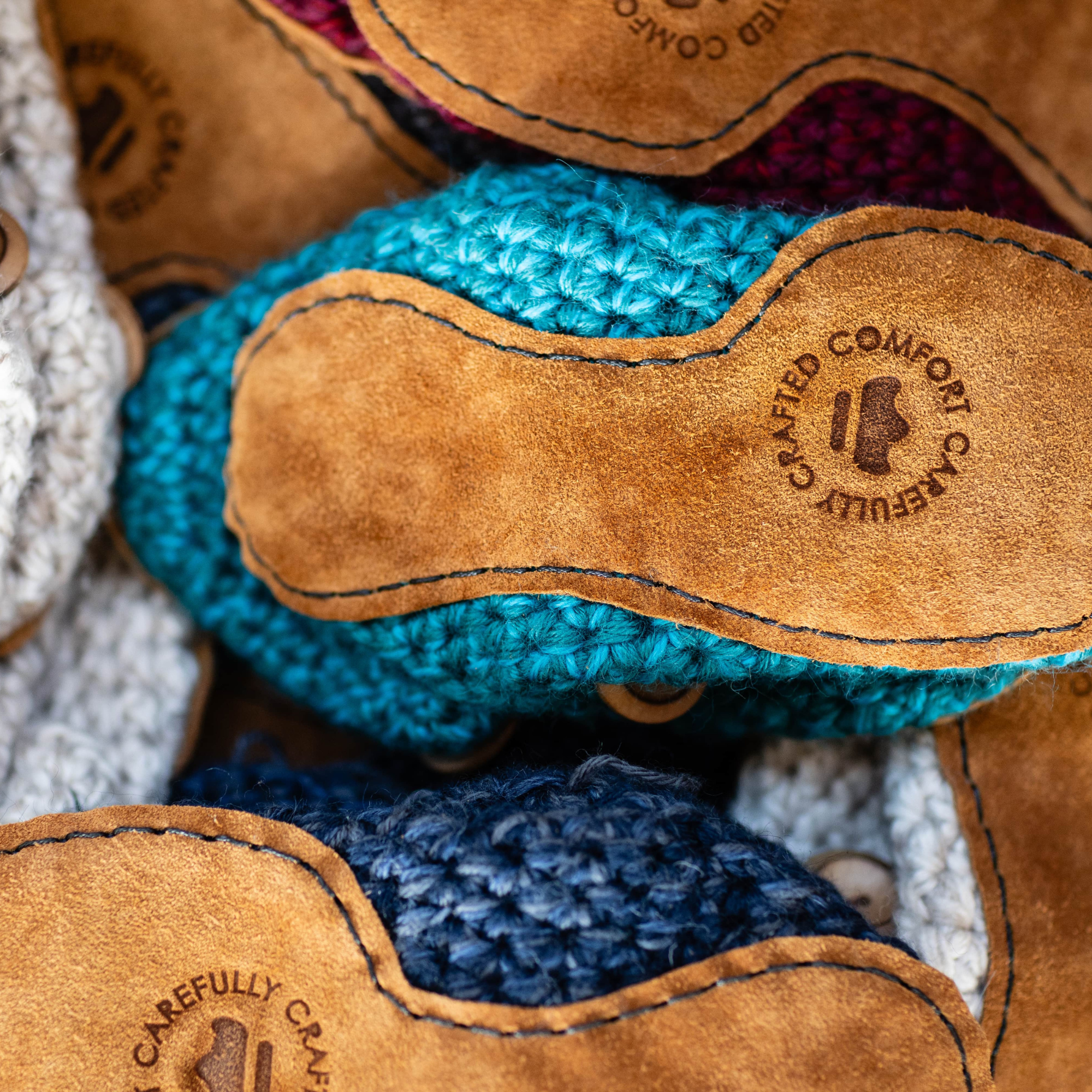 Person wearing teal crocheted wool slippers by Kingdom of Wow_video