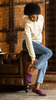 Woman wearing purple crocheted wool slippers by Kingdom of Wow_video