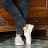 Woman wearing white KOW wool slippers
