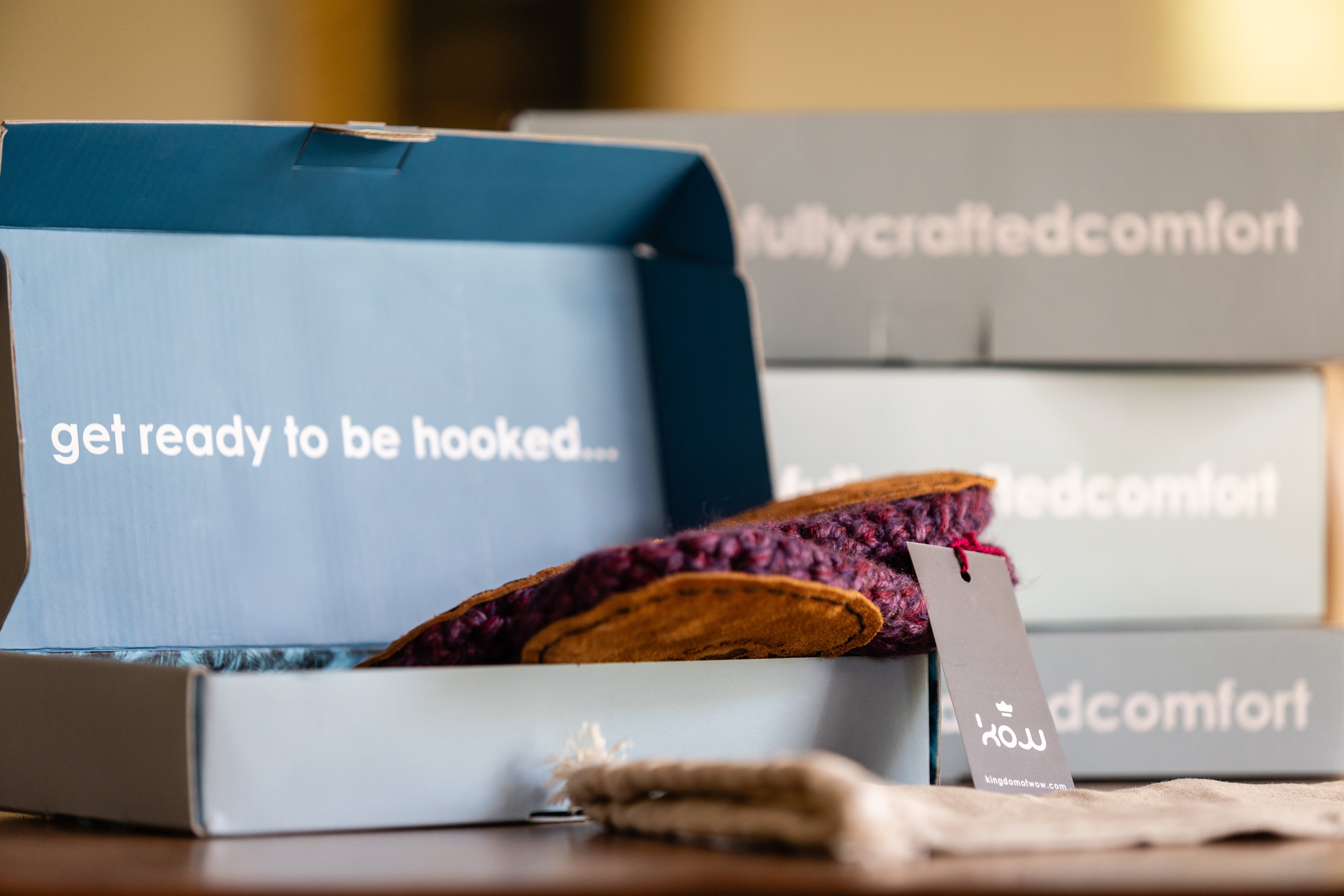 Unboxed pair of lavender purple wool slippers by kingdom of wow